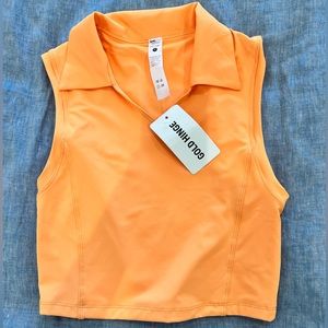 GOLD HINGE - Size Small athletic top.